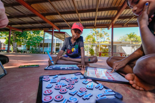Aboriginal students learning in an outdoor classroom. 
